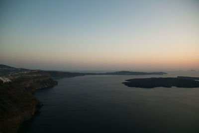 Scenic view of sea against clear sky during sunset