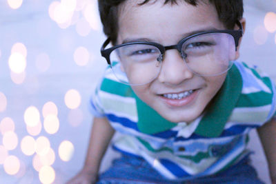 Portrait of smiling cute boy wearing eyeglasses
