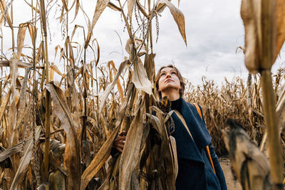 Low angle view of woman standing on field