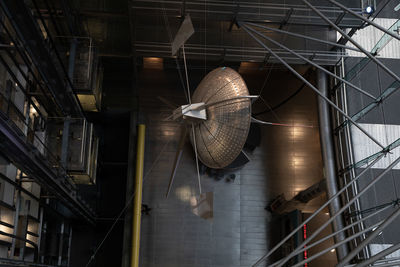 Low angle view of lighting equipment hanging on ceiling