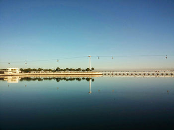 Overhead cable cars over lake