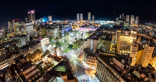 High angle view of illuminated buildings in city at night