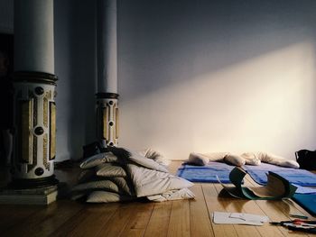 Stack on pillows on hardwood floor at home