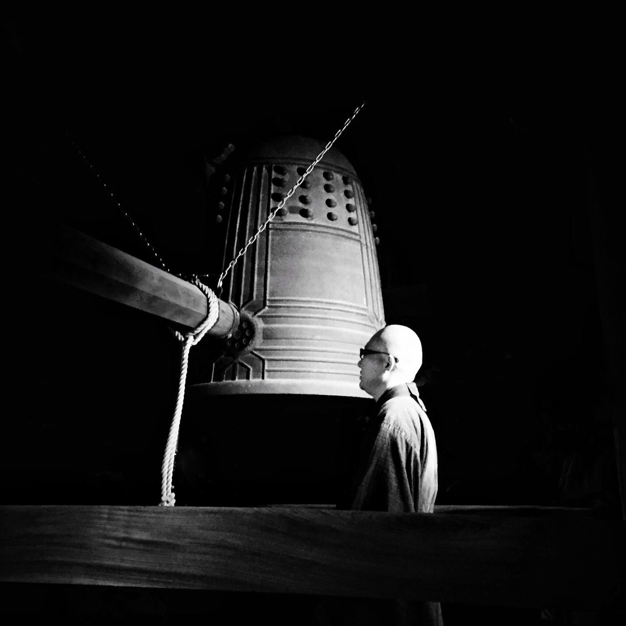 night, low angle view, built structure, architecture, building exterior, illuminated, religion, place of worship, spirituality, statue, sculpture, human representation, art, art and craft, creativity, no people, church, dark