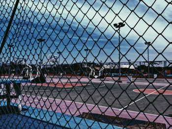 Full frame shot of chainlink fence against sky