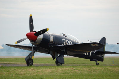 Close-up of airplane on field