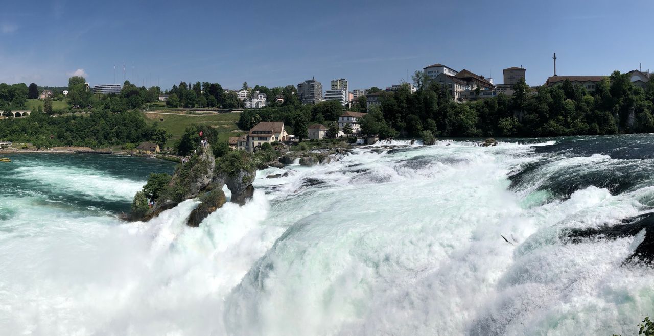 SCENIC VIEW OF WATERFALL AGAINST SEA