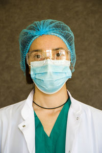 Woman doctors portrait, doctors with mask, glasses, glove and uniform. uniform for surgery 