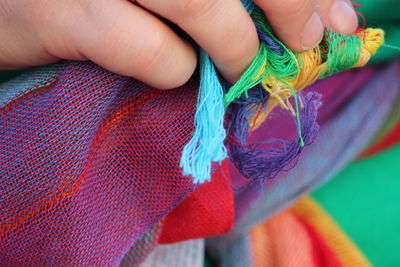 Close-up of hand holding rope