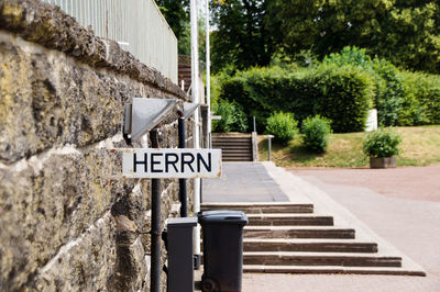 Road sign on old wall