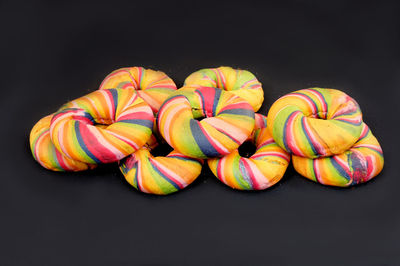 Multi colored pencils against black background