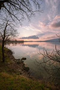 Scenic view of lake against sky during sunset