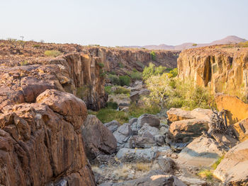 Scenic view of cliff against clear sky