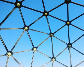 Low angle view of metal structure against sky