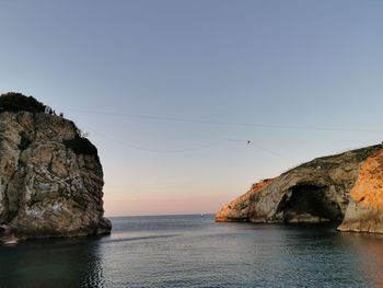 Scenic view of sea against clear sky during sunset