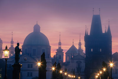 Misty mornig from charles bridge. colorful sunrise over towers of prague, czech republic.