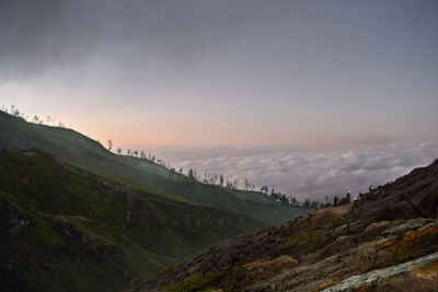 Scenic view of mountains against sky during sunset