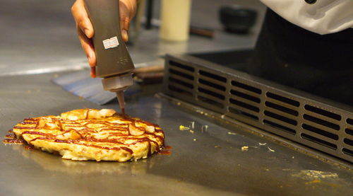 Close-up of man preparing food