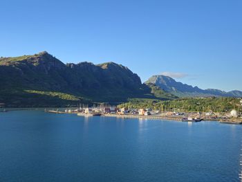 Scenic view of sea against clear blue sky