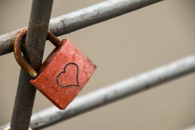 Close-up of padlock on railing