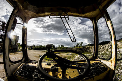 Close-up of motorcycle against sky