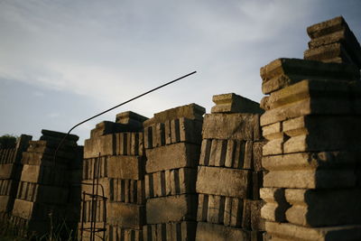 Low angle view of stack of building against sky