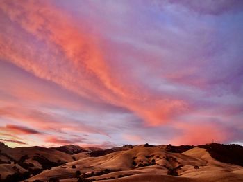 Scenic view of dramatic sky during sunset