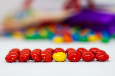 Close-up of multi colored candies on table