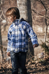 Low section of boy looking at camera