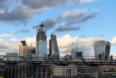 Modern buildings in city against sky