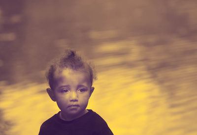 Portrait of boy against blurred background