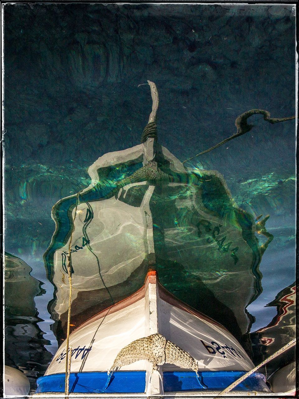 CLOSE-UP OF BOAT IN SEA AGAINST SKY