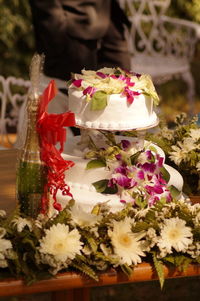 Close-up of hand holding flowers