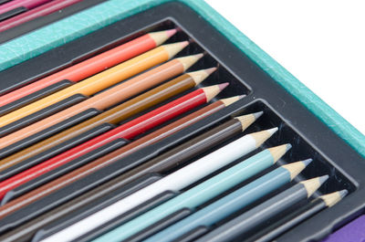 Close-up of colored pencils in container
