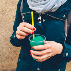 Close-up of hand holding drink