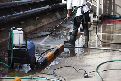 Low section of man working at construction site