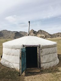 Built structure on land against sky