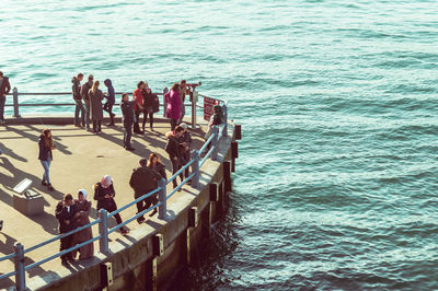 High angle view of people enjoying at sea