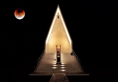 Full frame shot of illuminated building against sky at night