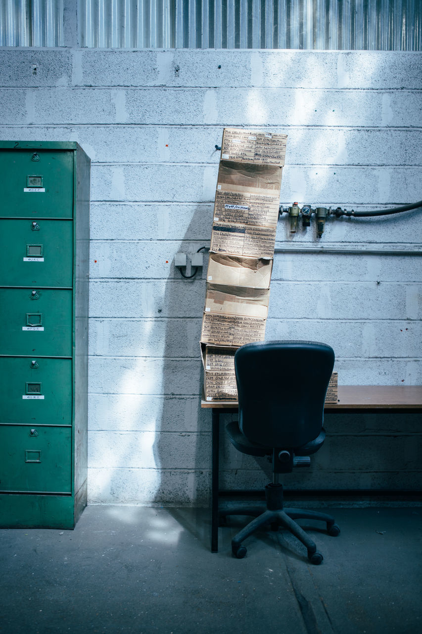 no people, built structure, day, wall - building feature, architecture, seat, chair, sunlight, absence, empty, nature, outdoors, shadow, wall, communication, building exterior, wood - material, still life, furniture