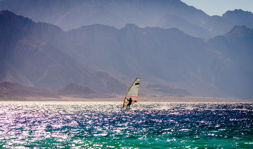 Scenic view of sea against mountains