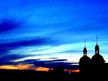 Silhouette cathedral against sky during sunset