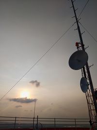 Low angle view of silhouette street light against sky during sunset