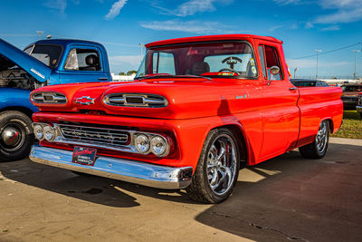 Vintage car on road against blue sky