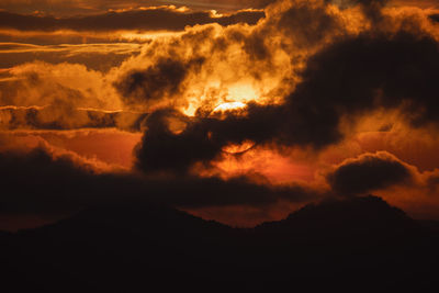 Low angle view of dramatic sky during sunset