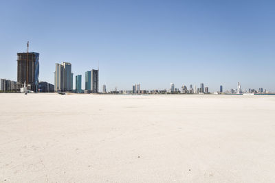 Scenic view of beach against clear sky