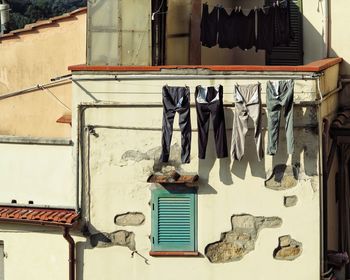 Low angle view of clothes drying outside building