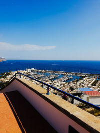 High angle view of swimming pool by sea against sky