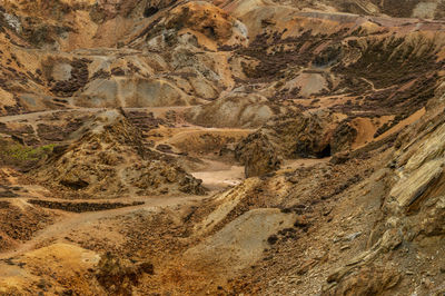 The orange and brown landscape of the disused parys mountain copper mine, anglesey, north wales.