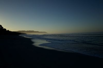 Scenic view of sea against clear sky during sunset